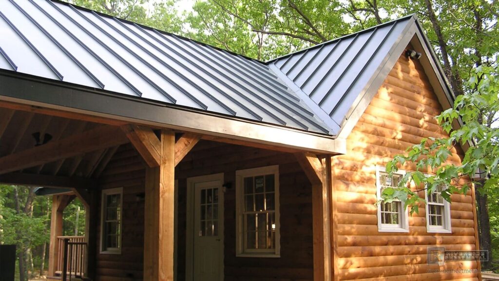 Log cabin with a grey standing seam metal roof and a covered wooden porch.
