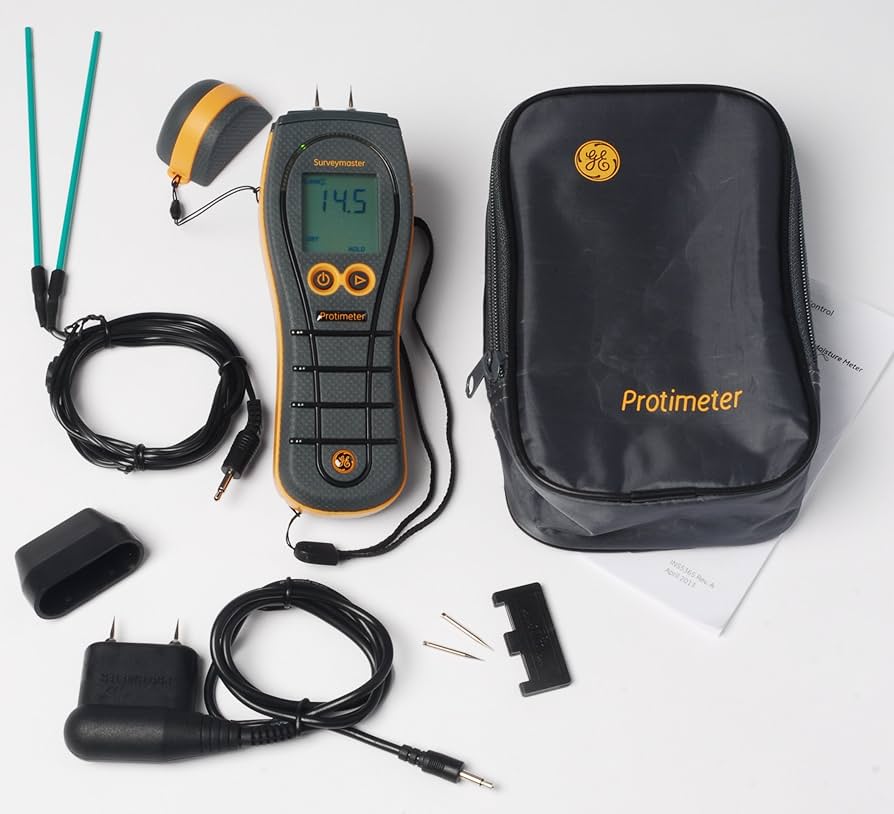 Protimeter Surveymaster moisture meter kit with digital display unit, probes, cables, and black carrying case.