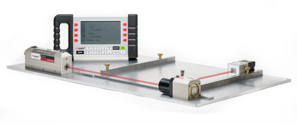 Pinpoint laser alignment system with a transmitter, receiver, and digital display on a metal base plate.