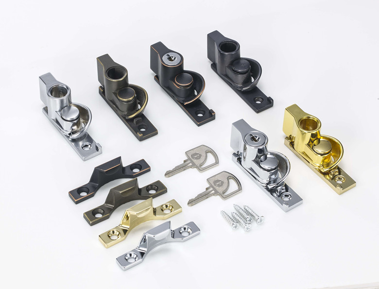 Window sash locks in various metal finishes, shown with matching keepers, keys, and mounting screws.