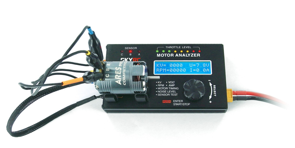 SkyRC Motor Analyzer connected to an electric motor, displaying performance data on a digital screen.