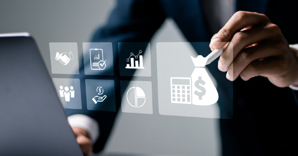 A business person interacts with a digital interface featuring icons for financial planning, data analysis, and teamwork.