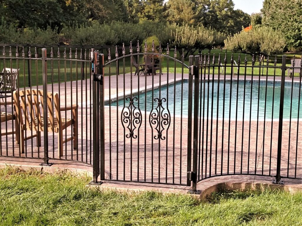 custom wrought iron metal fencing inground pool scroll gate child safe enclosure classic black steel galvanized fence paver patio furniture