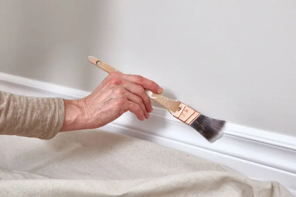 homeguide professional painting baseboards white in a house