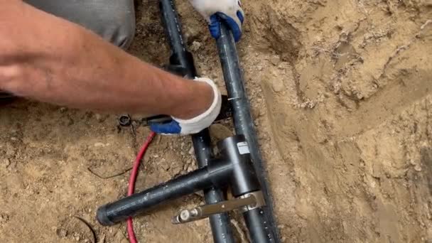 depositphotos 590642510 stock video plumber cuts plastic pipes using