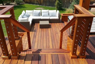Custom-Decks-tigerwood-deck-planters-cable-rail-tigerwood-posts-top-cap-nana-wall-Greenwood-Village-Colorado