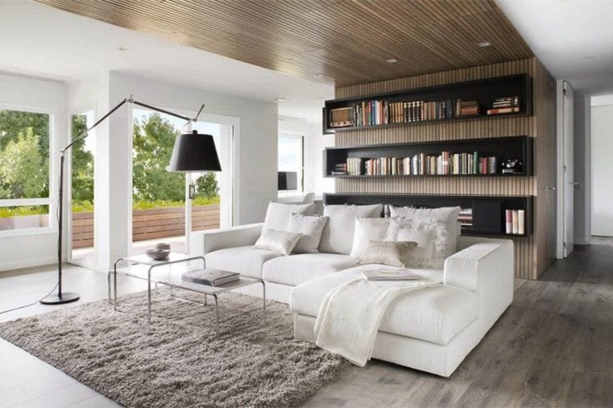 *   Image: A modern living room.
    *   Key elements: White sectional sofa with pillows, grey shag rug, white coffee table,