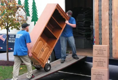 Movers carrying heavy item together