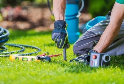 Garden Automatic Watering Systems Installer. Garden System Technician at Work.