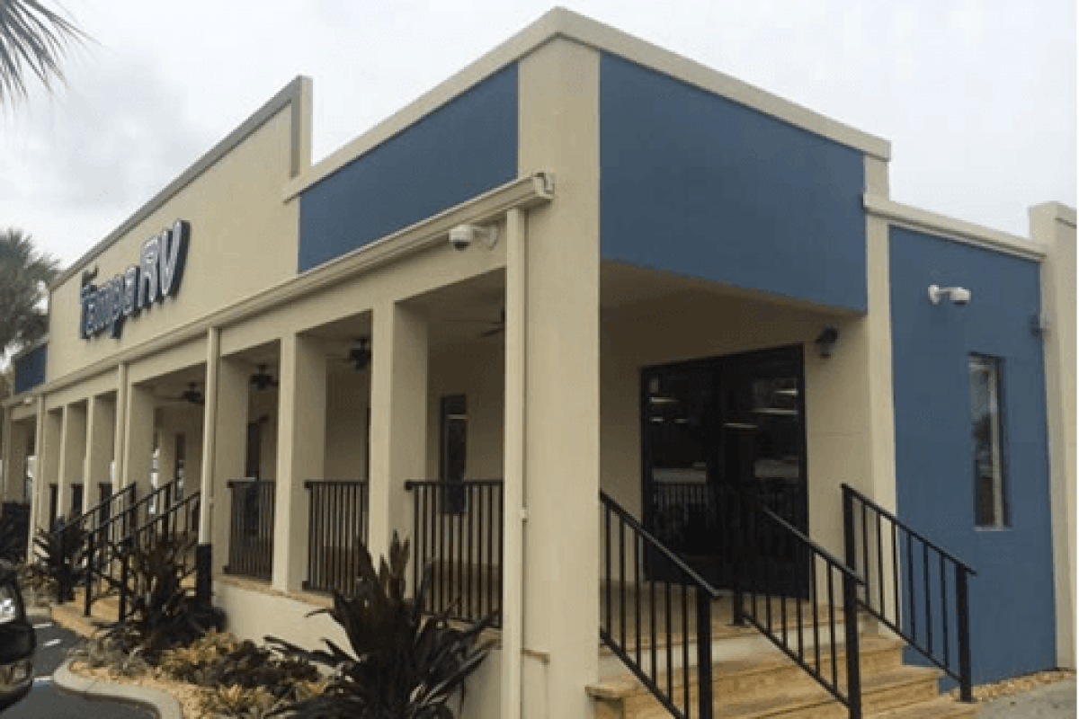 *   Image: A commercial building with a sign that says "Tampa RV".
    *   Building features: Beige and blue exterior, a porc