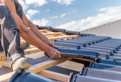 manufacture of the roof of a family house from ceramic tiles. copy space