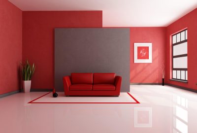 *   Image content: A modern, minimalist living room.
    *   Key elements:
        *   Red walls.
        *   A grey accent w
