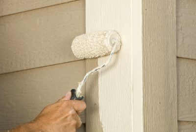 House Painter Rolling Siding Trim Board